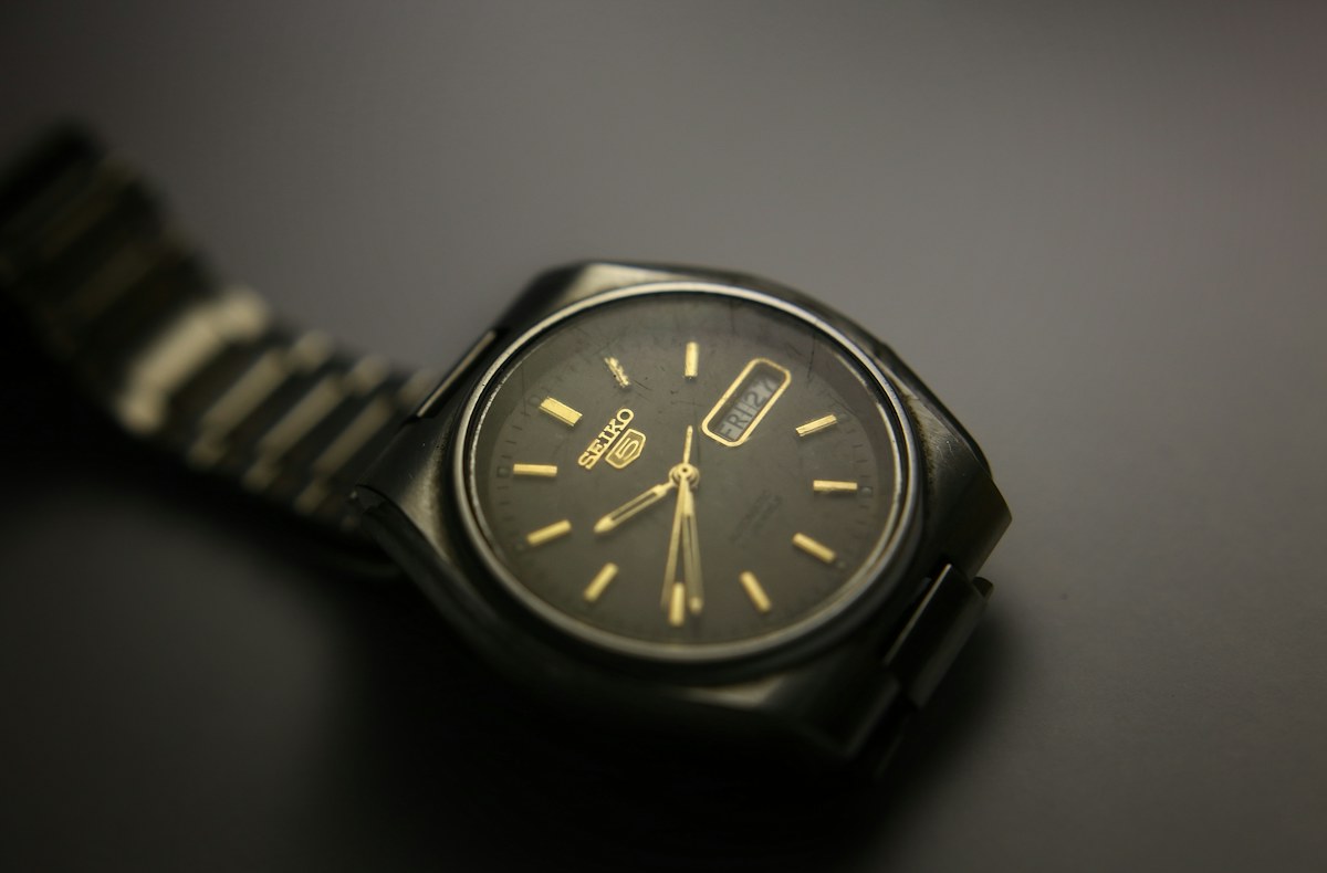 Vintage silver wristwatch with a dark dial